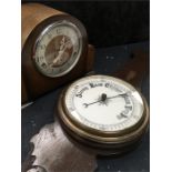 An Enfield mantle clock with an aneroid barometer.