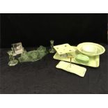 An Art Deco seven piece dressing table set in green glass, an Art Deco photo frame and a 1950's