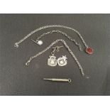 A silver Albert and fob together with two smaller chains and two fobs and a propelling pencil