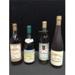 Four bottles of wine: Monbazillac, 1994 Cotes du Rhone, Montravel and 1994 Moscatel de Valencia.
