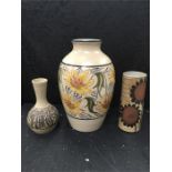 Two Purbeck Pottery vases including a very large floral patterned one.