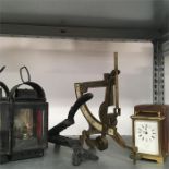 Two vintage night watchman lights together with postal scales, a Victorian cast iron nutcracker