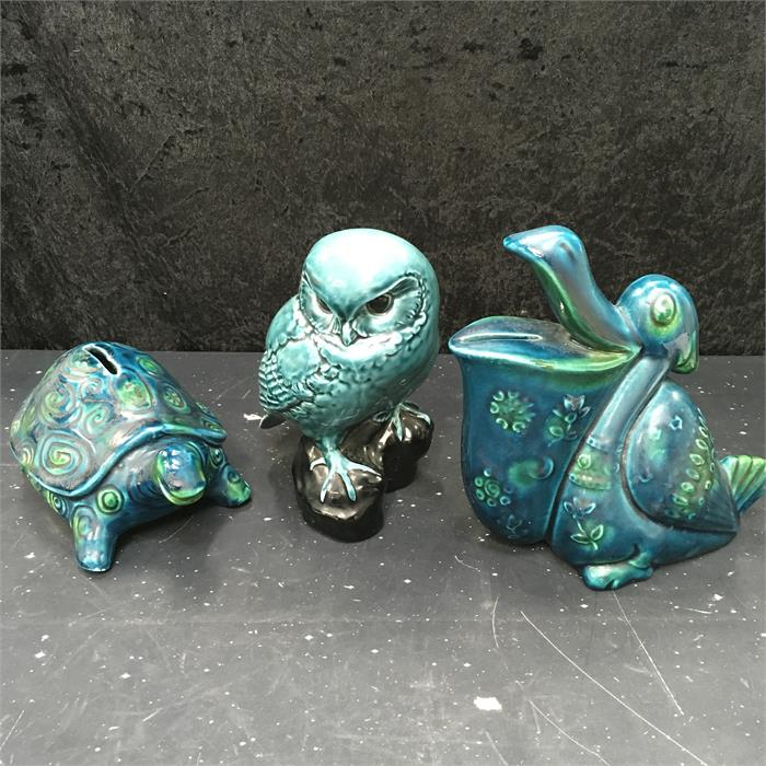 Three pieces of green pottery including a Poole Pottery owl.