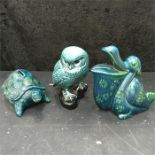 Three pieces of green pottery including a Poole Pottery owl.