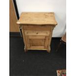 A Continental pine left top ladies dressing table fitted single drawer and cupboard resting on