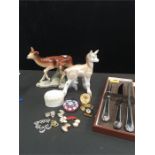 A mixed lot including silver plated carving set two animal figurines10 sets of earrings and other
