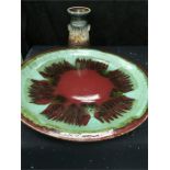 A large colourful multi coloured red with crypto crystalline glaze pottery charger (Diameter 20")