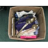 A box containing various designer clothes including Christian Dior shirts and other miscellaneous