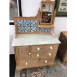 A Victorian marble topped washstand fitted side mirror, tiled back cupboard, two small drawers