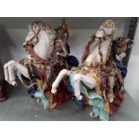 Two large china galloping horse and knights. Slight damage to both.