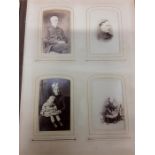 A damaged photo album containing black and photo with one other and a large family bible with