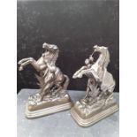 A pair of Spelter horse trainer statues stamped on base JM made in Belgium