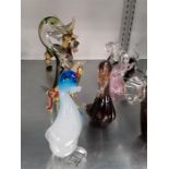 Ten various coloured glass animals.