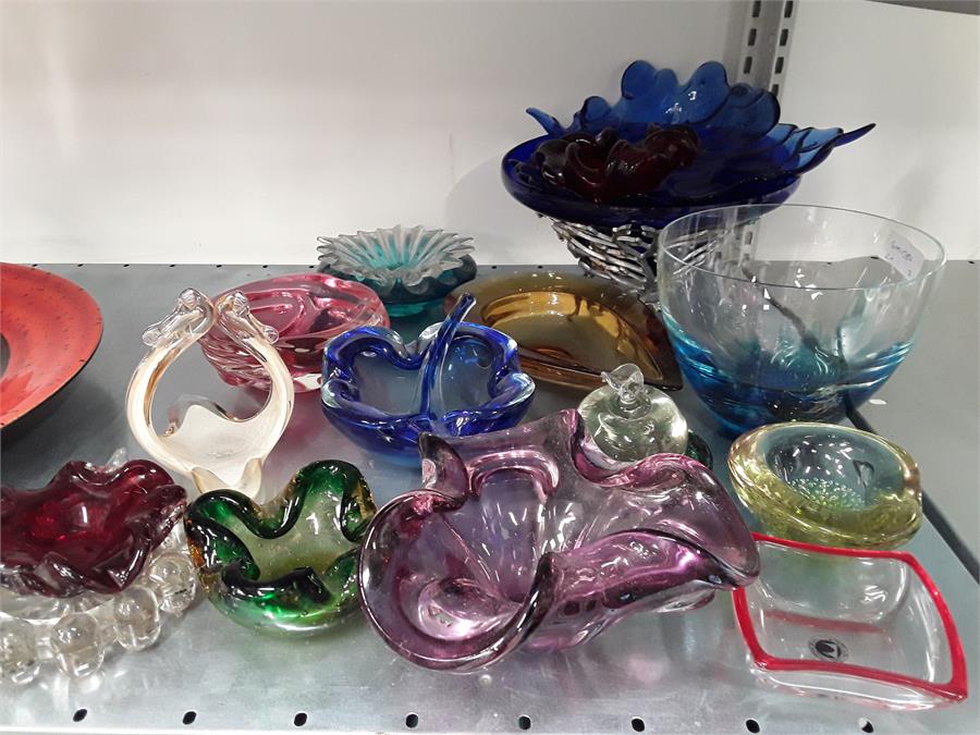 Various coloured and shaped glassware.