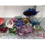 Various coloured and shaped glassware.