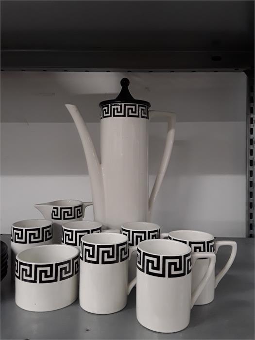 The residue of a black and white geometric Portmeirion coffee set. One cup handle broken off. - Image 3 of 3