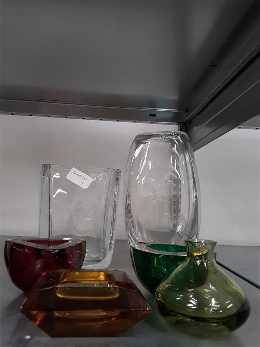 Glassware to include two large clear glass vases and four small coloured glass bowls.