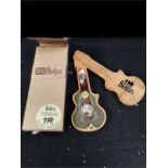 A limited edition Beatles watch in wooden guitar case