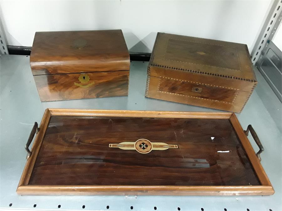 Two small wooden boxes together with a twin handled wooden tray.