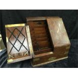 An early 20th century stationery box in oak with fitted interior and brass fittings.