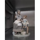 A Lladro old lady figure in good condition.