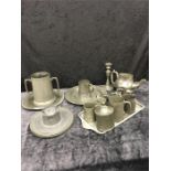 A mixed lot of pewter including tankards, an inkwell, plates, etc.