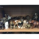 A collection of ornamental animal figures and North American Indians.