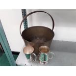 A brass jam pan together with two mugs.