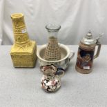 A stein, vase and selection of other containers