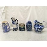 Five blue and white china jugs and containers.