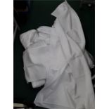 A quantity of linen table clothes and serving clothes.