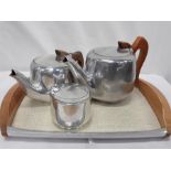 A Picquot tray, tea pots and sugar bowl.