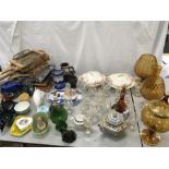 Box of glassware and other various items. Includes Poole Pottery dolphins, pictures and rackets.