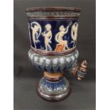 A late 19th century Royal Doulton blue and green glazed water, brandy urn decorated with a panel