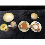 Clarice Cliff Crocus Pattern: marmalade pot, sugar and cream jug and a trio (6) (slight rubbing to