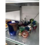 A collection of mixed glassware to include vases and bowls.