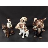 Six ceramic dogs including a Jack Russell, Retriever, German Shepherd, Fox Terrier and Springer