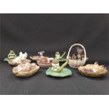 Ten small ceramic collectables of animals.