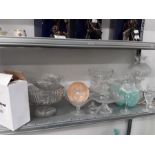 A large collection of clear pressed glass together with a cut glass lamp.