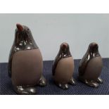 Three stoneware Penguins.