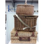 Wicker items to include a hamper, basket and fishing box.