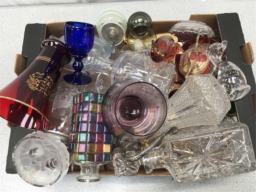 A box of glassware to include decanters, vases and ornaments.