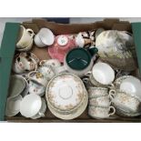 Two boxes of china cups and plates, examples from Wedgwood, Tuscan, Willow and others.