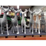 Six silver coloured Christmas reindeer's.