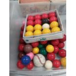 A box containing pool and snooker balls.