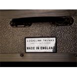 Three silver coloured cases, Logicline trunks and flight cases made in England.