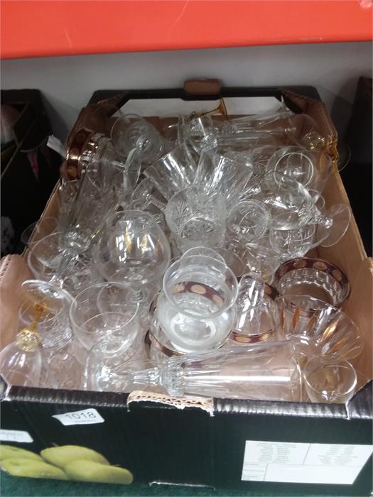 A box of glasses to include cut glass.