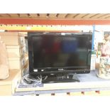 A Philips television with remote.