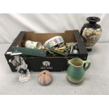 A box containing an assortment of metal, chinaware and a Poole Pottery bowl.