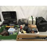 A large selection of photographic equipment. Includes a Sony video camera, tripod, various